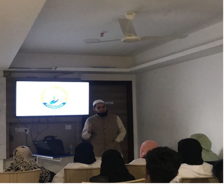 Dr. Saud Ahmed at a community health awareness session