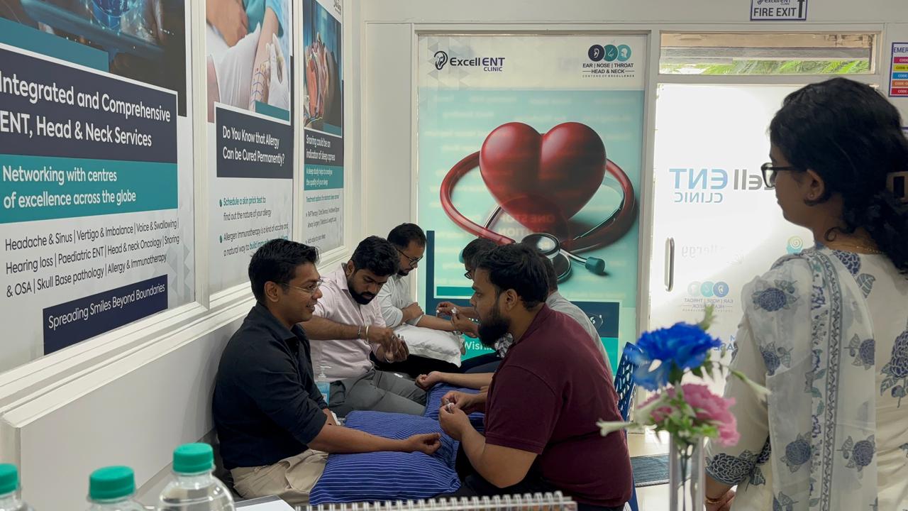 Doctors practicing hands-on allergy skin testing and immunotherapy techniques during the workshop