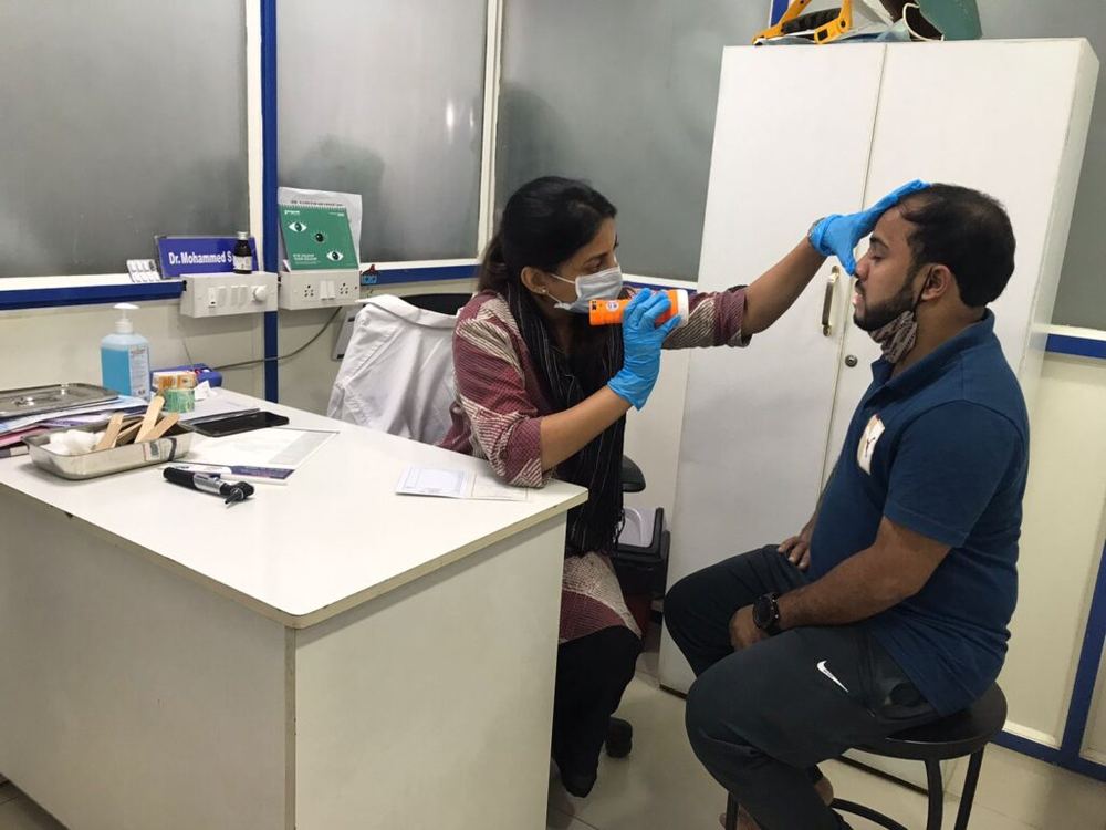 Excell ENT Clinic doctor examining a patient at a free health camp