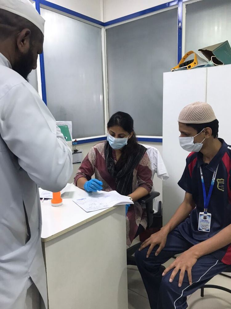 Excell ENT Clinic doctor consulting a young patient at a charitable health camp