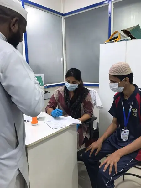 Excell ENT Clinic doctor consulting a young patient at a charitable health camp