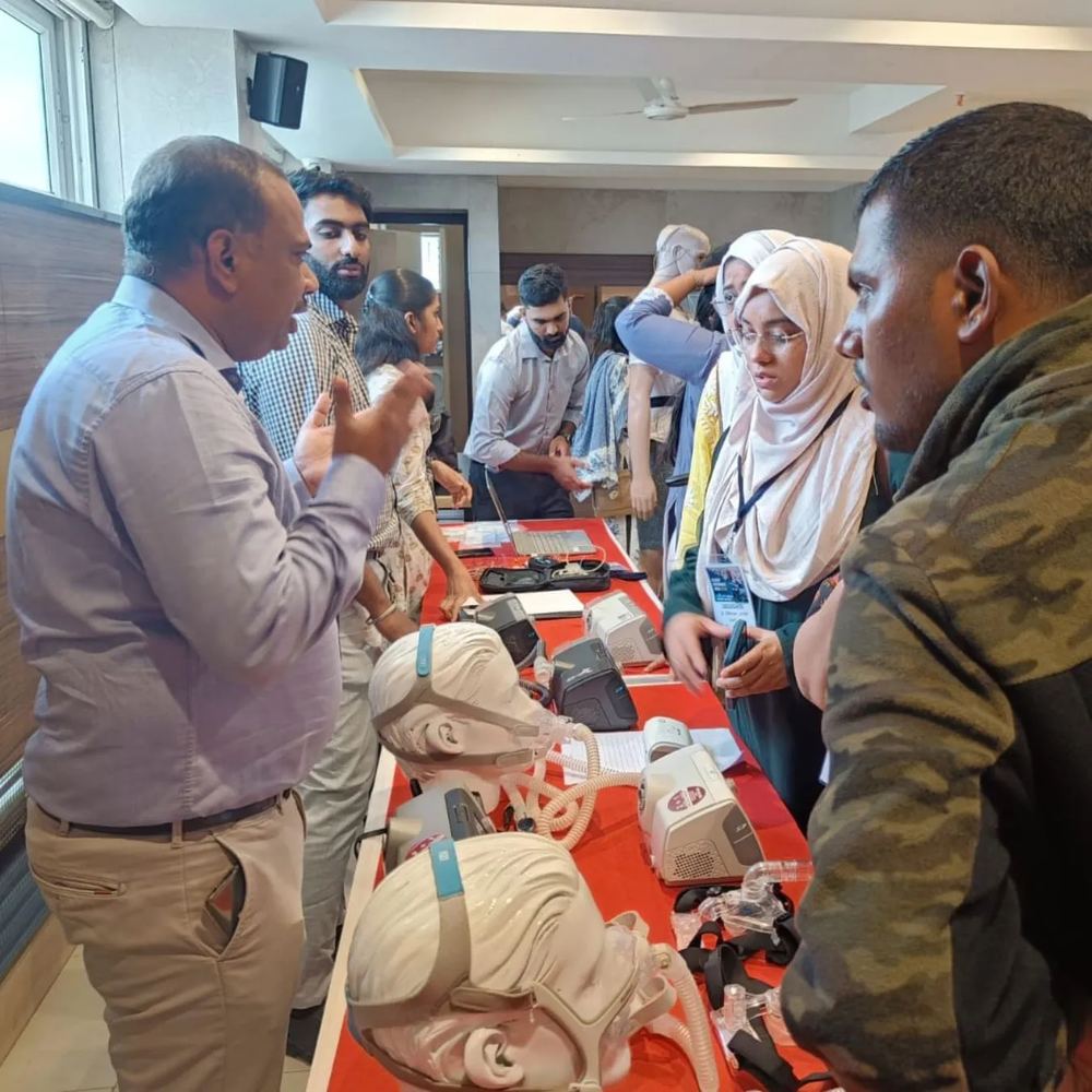 CPAP and sleep apnea equipment demonstration at a medical conference exhibition