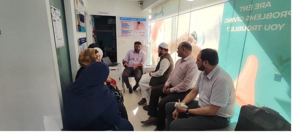 Dr. Saud Ahmed speaking at a medical seminar